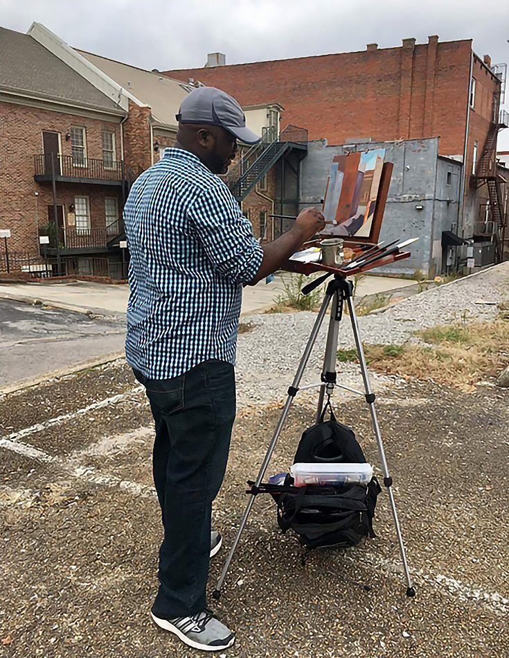 在一座老建築外畫“en plein air”